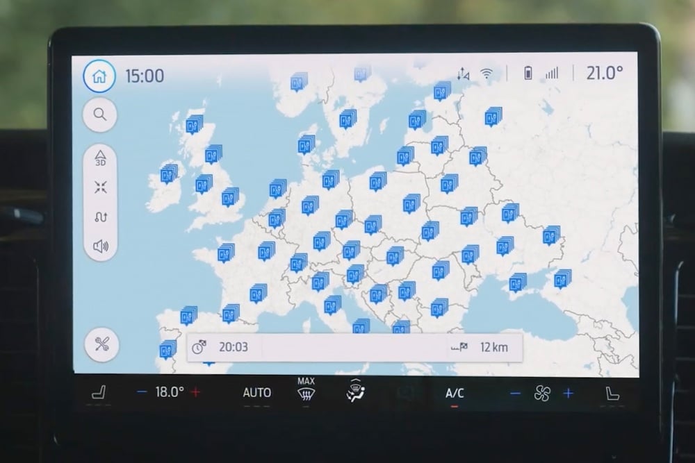A Ford vehicle's digital screen displays a map of BlueOval EV charging stations across Europe.