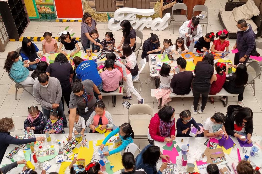 Children having fun with arts and crafts at a Ford Philanthropy community event.