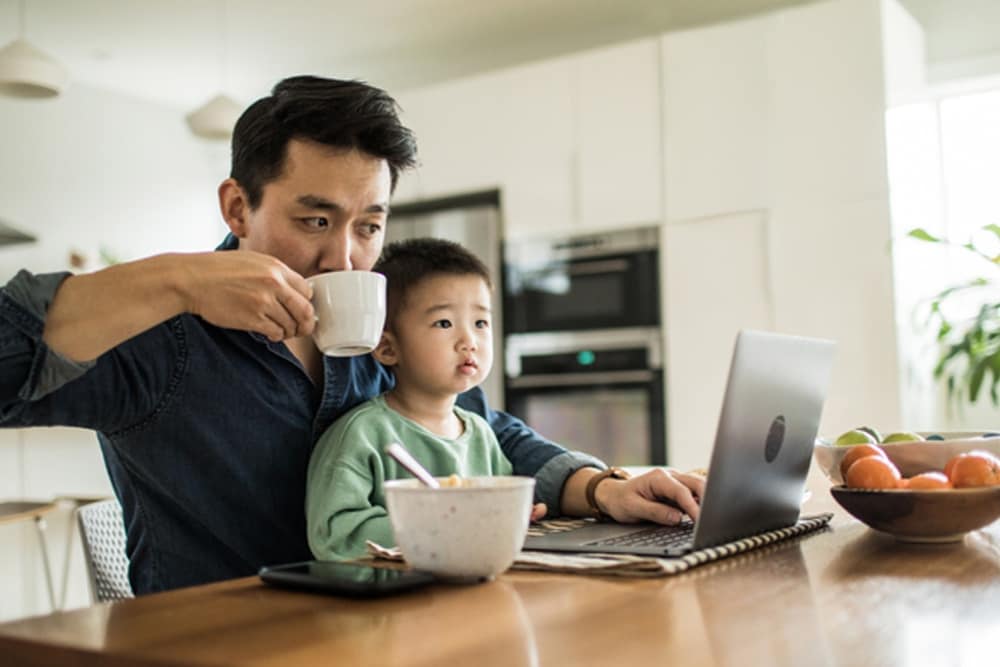 Man looking at online Ford account on a laptop
