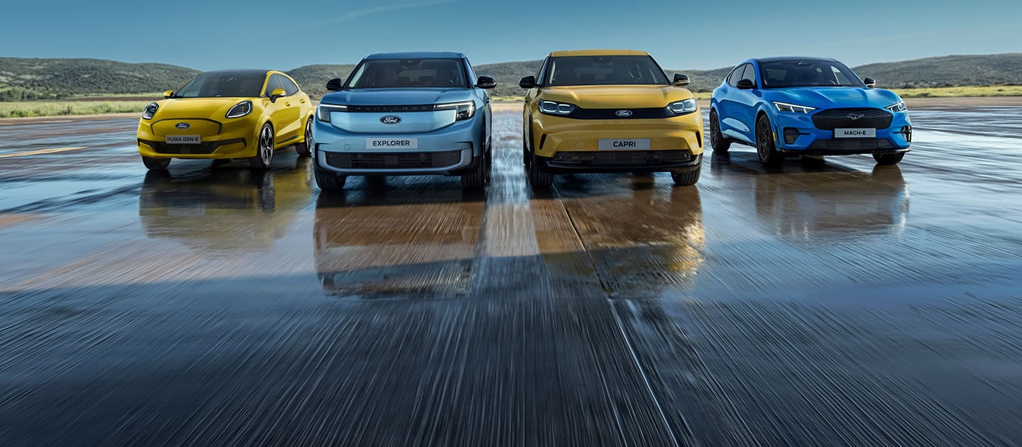 A line-up of the range of Ford electric cars, with the Ford Puma Gen-E, Ford Explorer, Ford Capri and Ford Mustang Mach-E.