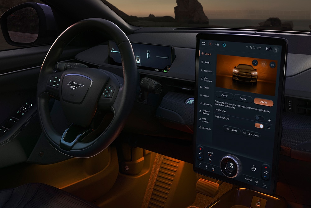 Interior view of the dashboard and steering wheel of a Ford electric vehicle.