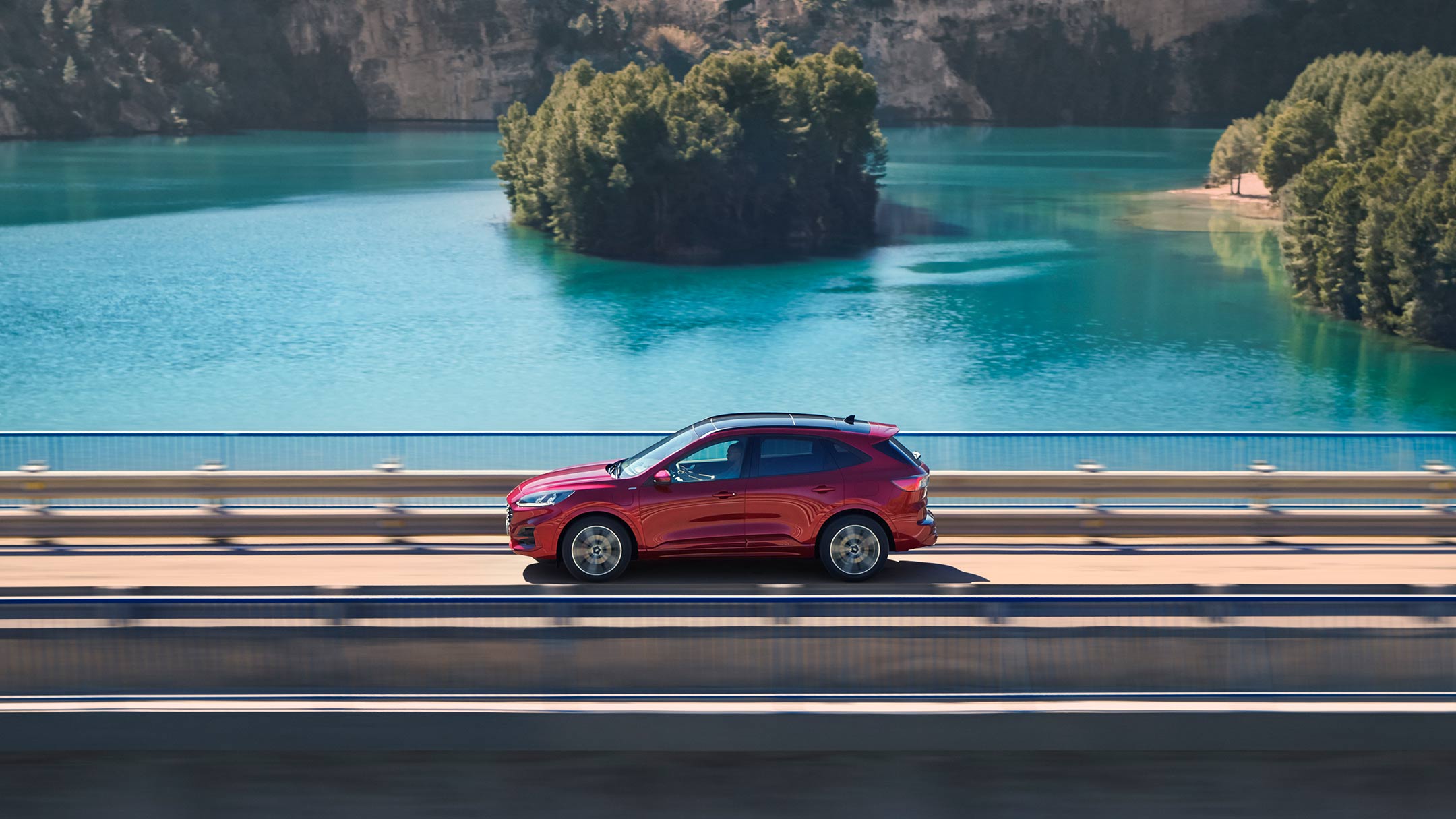 All Electric red Kuga on the bridge