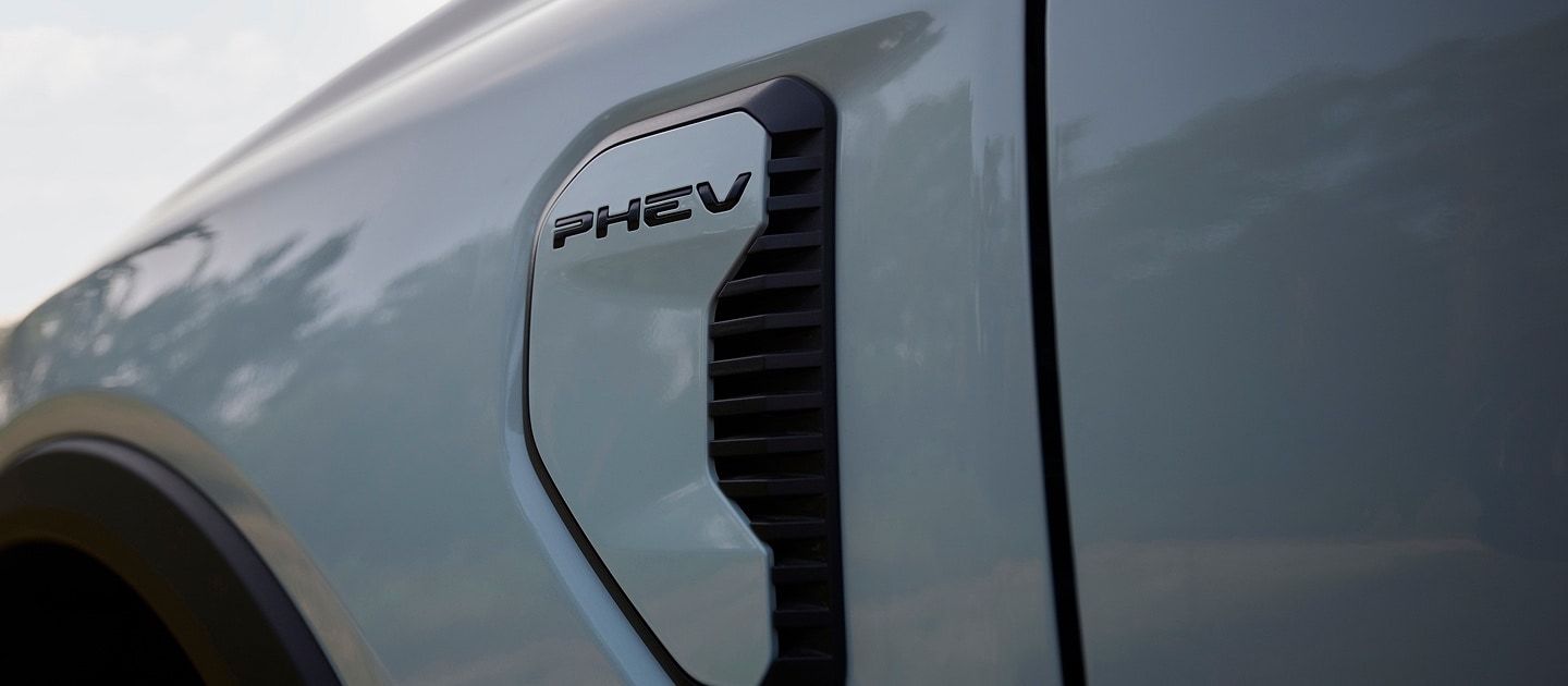 A close up of the PHEV badging on a Ford Ranger Plug-In Hybrid pick-up truck.