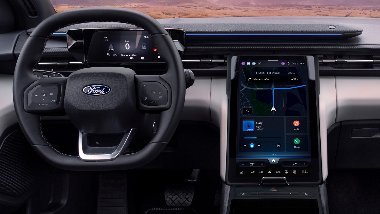 The interior of the all-electric Ford Explorer showing the steering wheel and SYNC Move touchscreen.