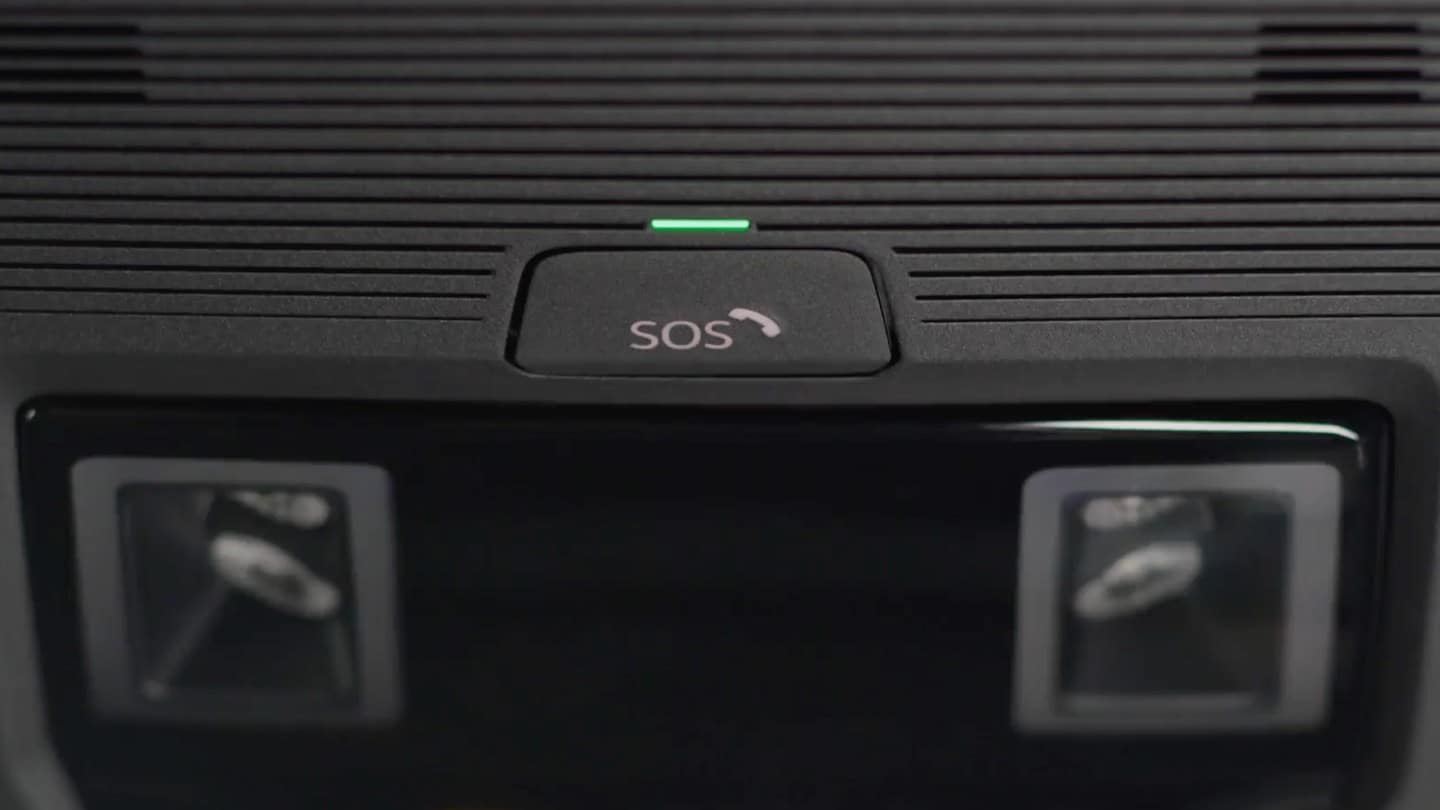 A close up of the SOS button of the eCall feature, positioned on the roof of the interior.