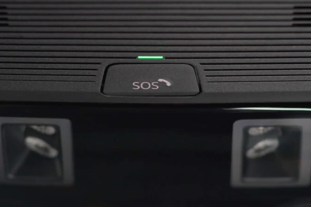 A close up of the SOS button of the eCall feature, positioned on the roof of the interior.
