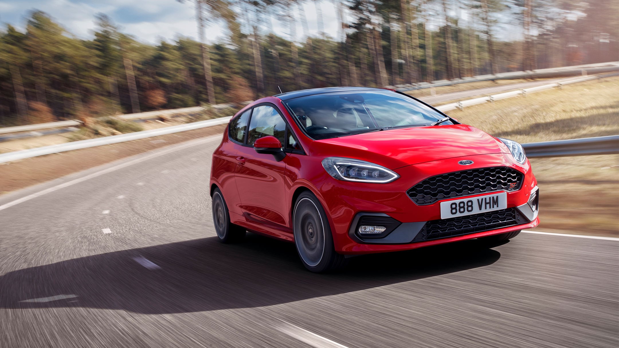 https://www.ford.co.uk/content/dam/guxeu/rhd/central/cars/2018-fiesta-st/launch/gallery/exterior/16x9/ford-fiestaST-eu-Fiesta_ST_Red_3dr_3_4_Front_Dynamic_RHD_01a_V2-16x9-2160x1215.jpg.renditions.original.png