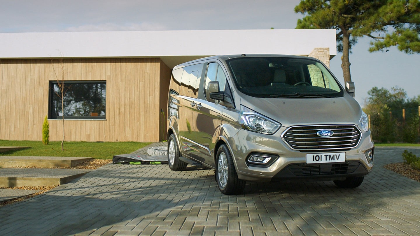 Ford Tourneo in front of house