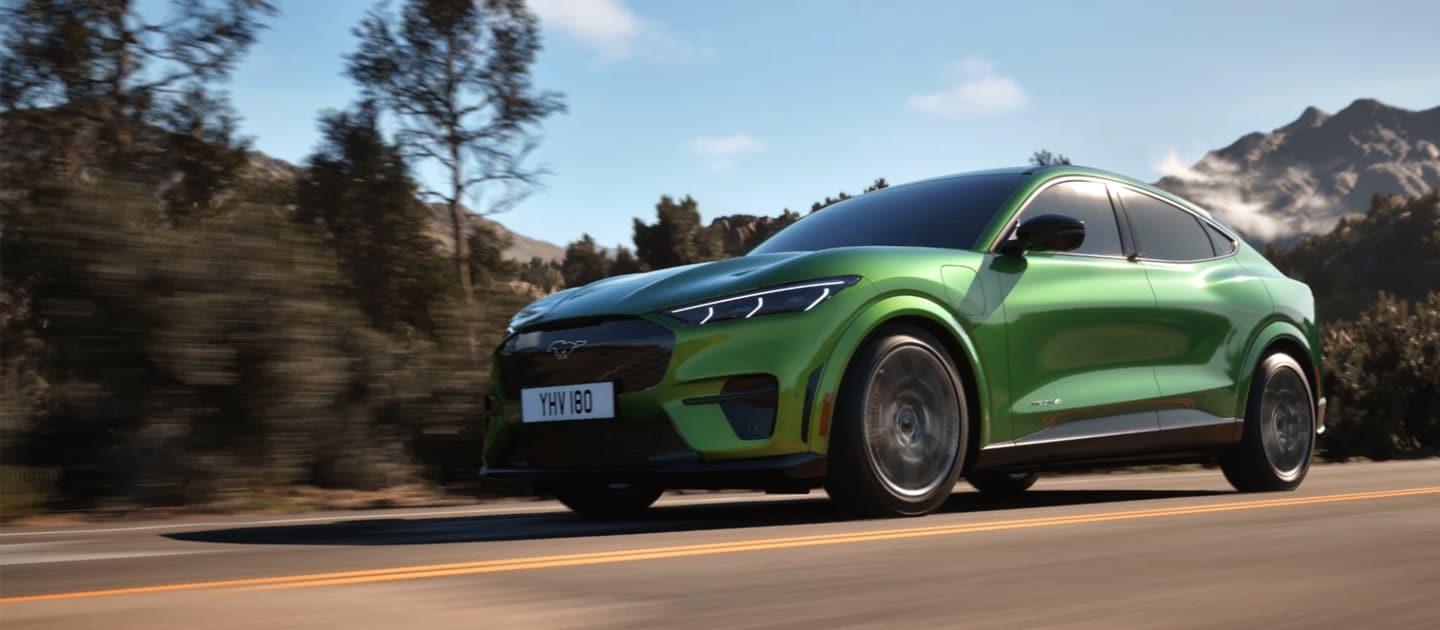 Green Ford Mustang Mach-E GT on the road.