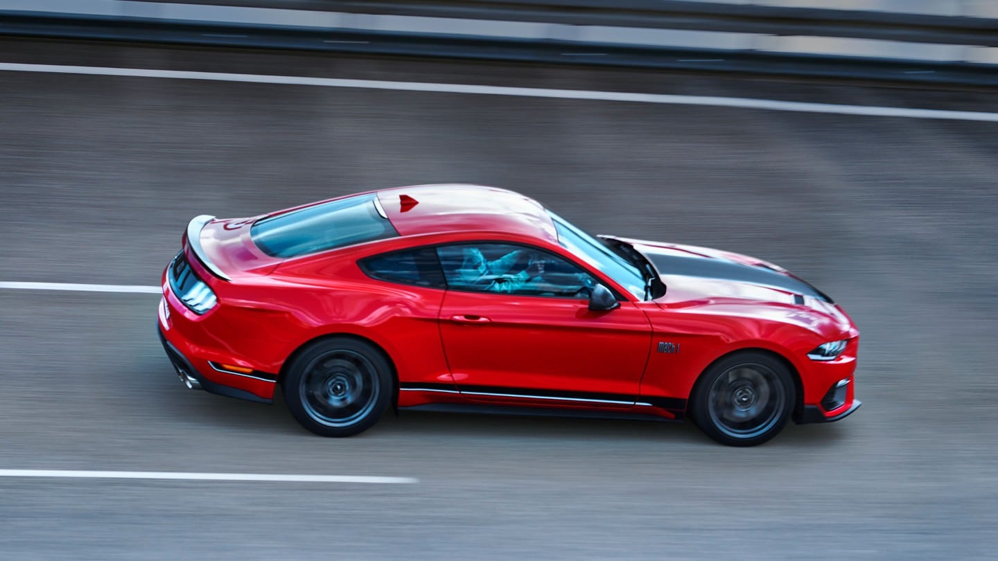 All-New Ford Mustang Mach 1 side view driving on a racing track