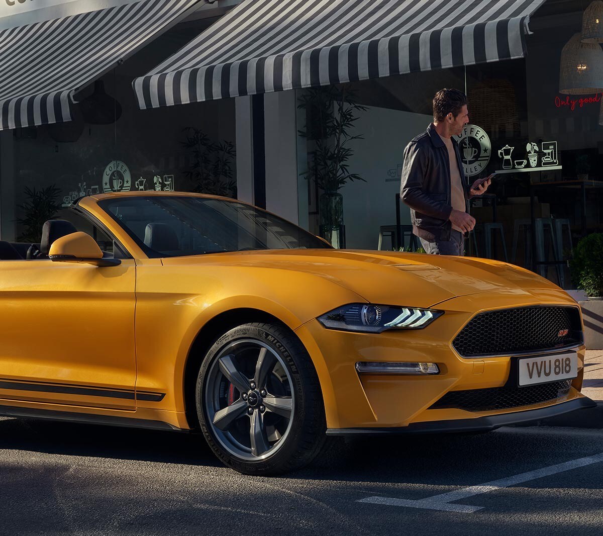 Ford Mustang California Edition parked infront of a coffee shop