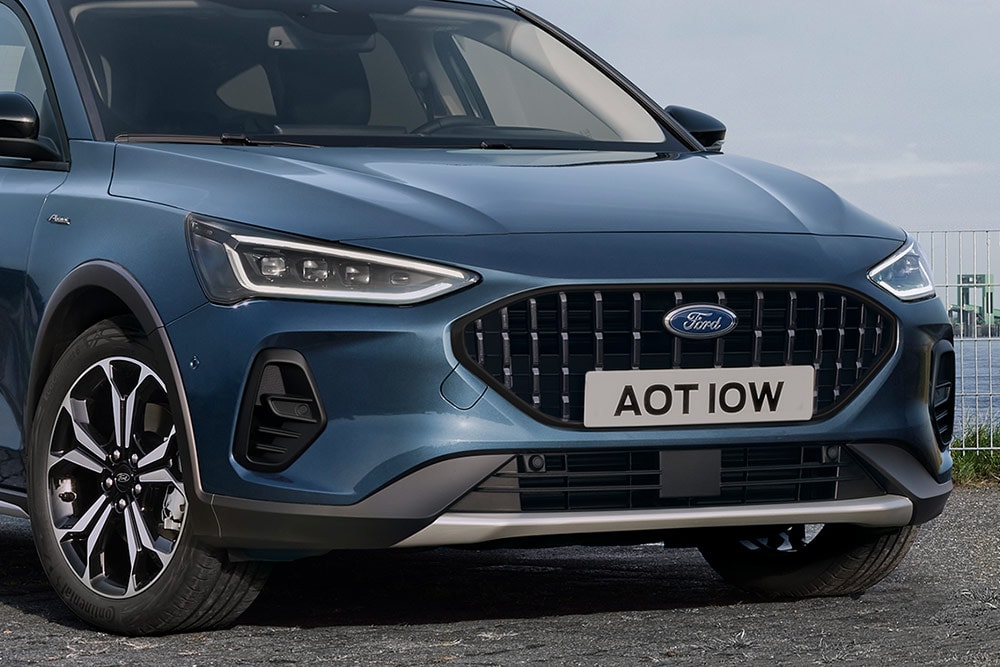 Front view of a dark blue Ford Focus Active hatchback, highlighting the headlights and front grille.