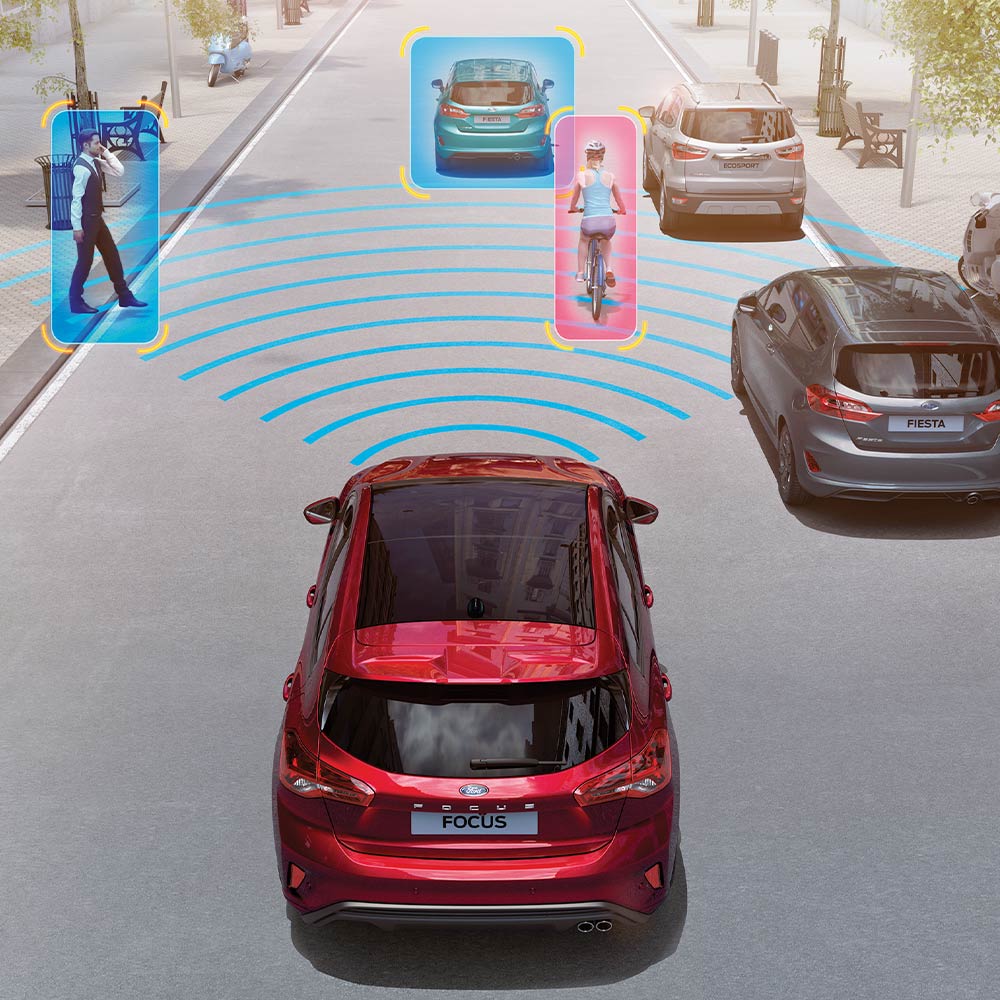 Illustration of a red Ford Focus with graphics depicting its safety and driver-assistance systems, including Pre-Collision Assist.