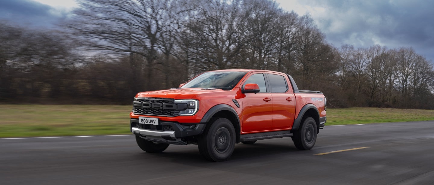 Ford Ranger Raptor driving road front 3/4 view