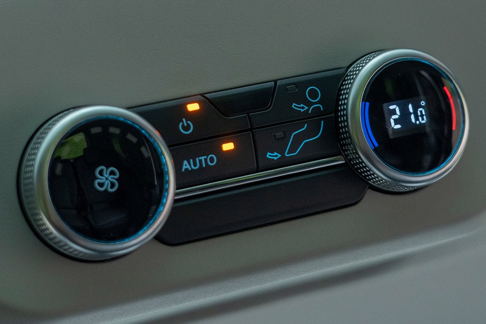 Close-up of vehicle climate control dials.