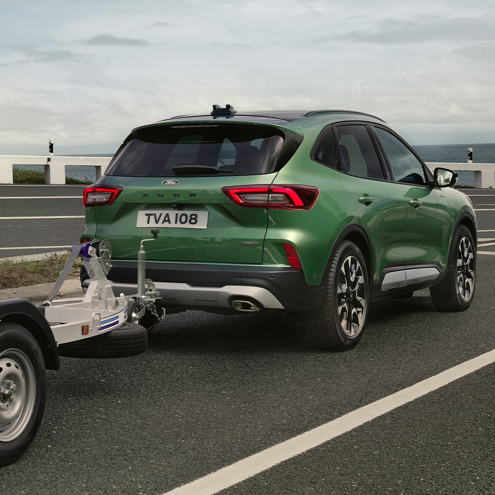 New Ford Kuga towing a boat rear view