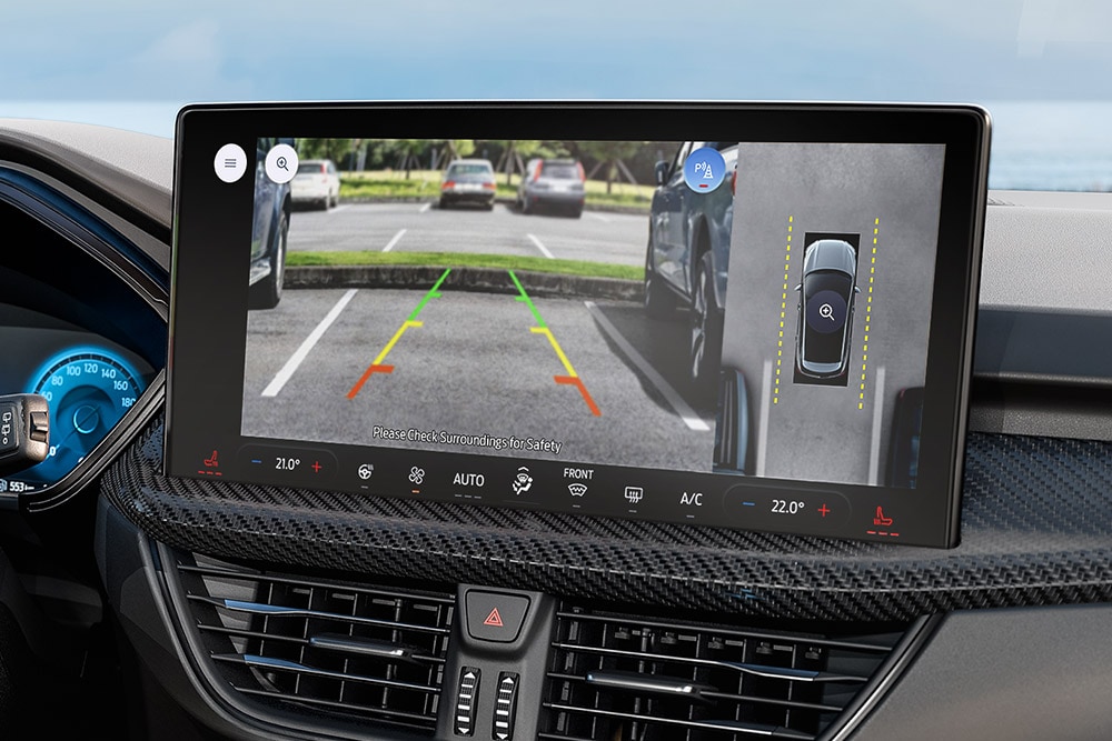 Close up view of a Ford Kuga central touchscreen showcasing its driver assist features.