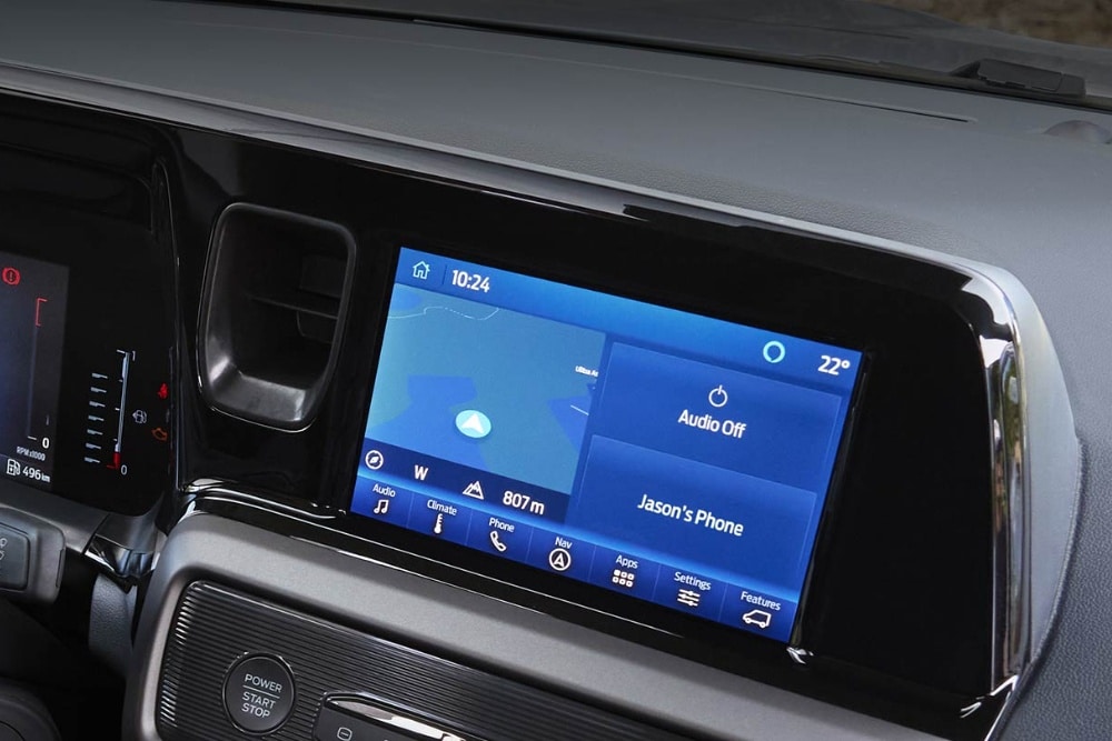 The infotainment screen in a Ford Tourneo Courier displays various functions including Phone List, Navigation, Sound, Vehicle, Clock, General, Display, and Connectivity.