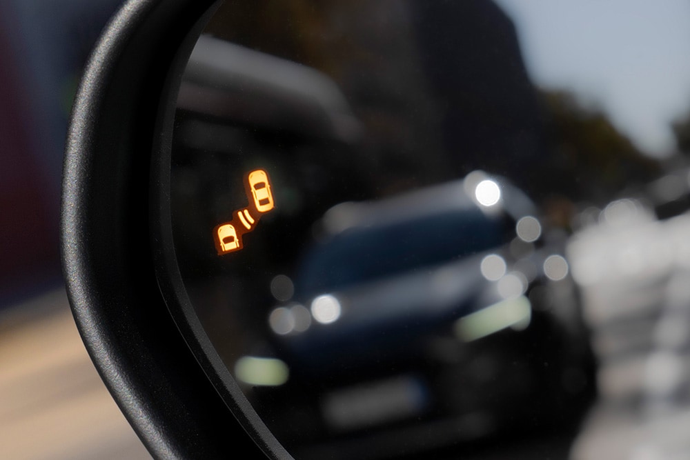 A close up of the Blindspot Information System alert in the side mirror of the Ford Puma Gen-E®.