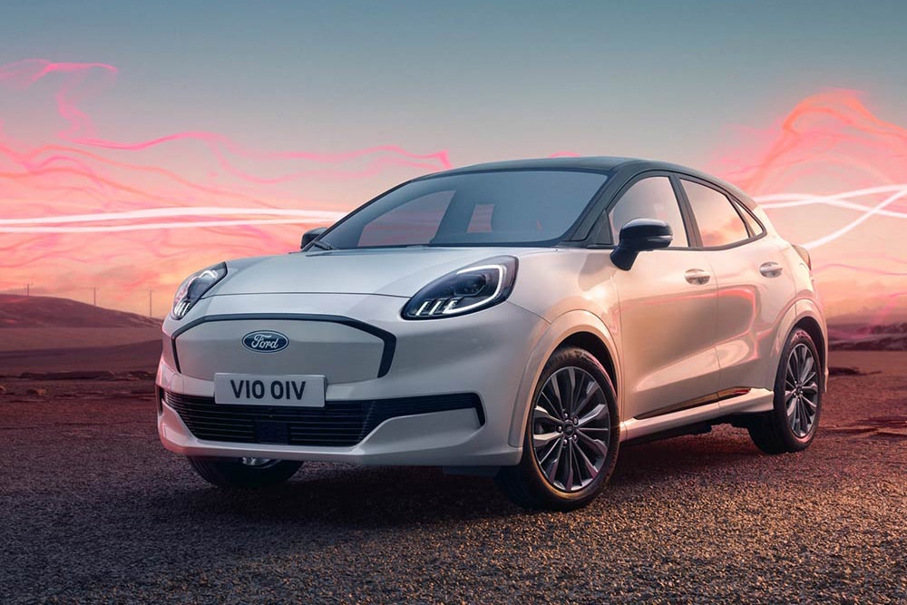 The Ford Puma Gen-E Sound Edition model in white, parked with red soundwave graphics in the background.