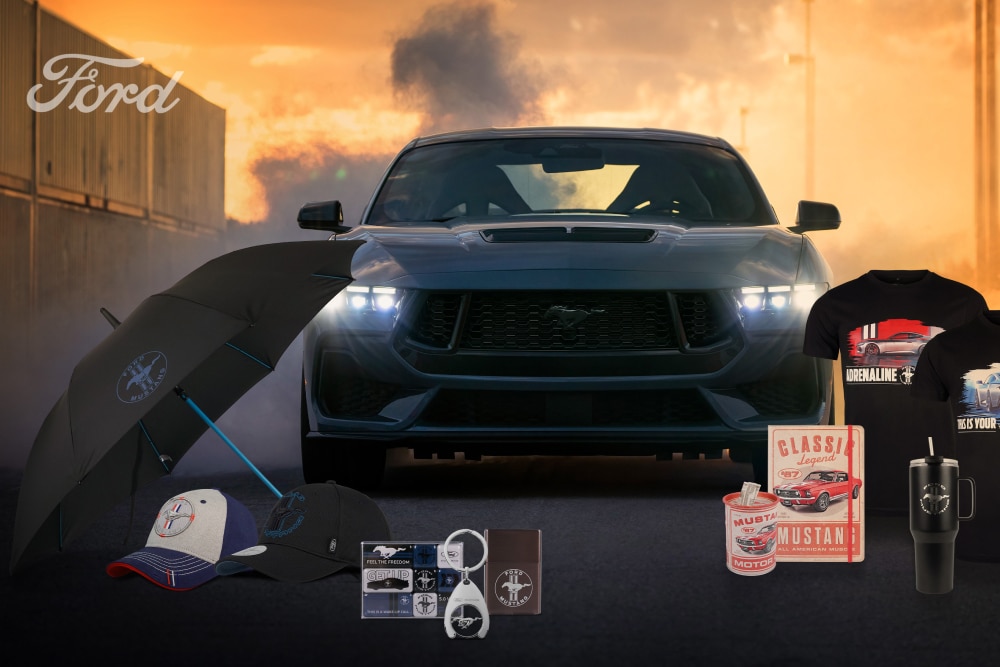 Ford Mustang Collection featuring a grey Mustang in the back with Mustang merchandise featuring an umbrella, caps, mugs, and t-shirts.