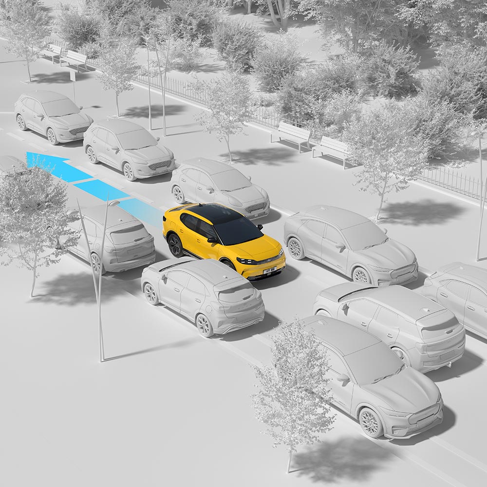 A yellow Ford vehicle navigating through traffic, highlighting the car's reversing assist feature.
