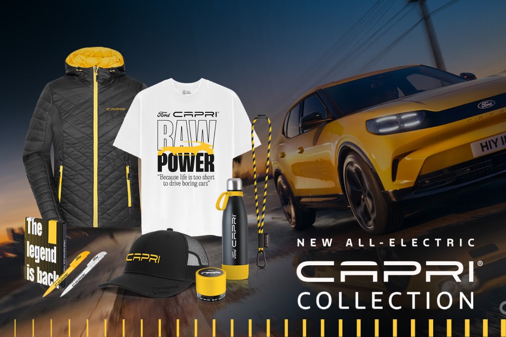 Black, yellow and white Ford Capri merchandise showing clothing, lanyard, cap, water bottle, stationery, and speaker, in front of a yellow Ford Capri.