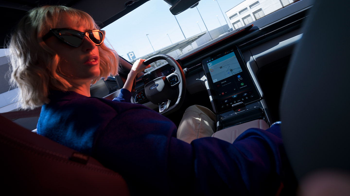 The new Ford Capri® with view of the steering wheel, dashboard and large SYNC® Move touchscreen.