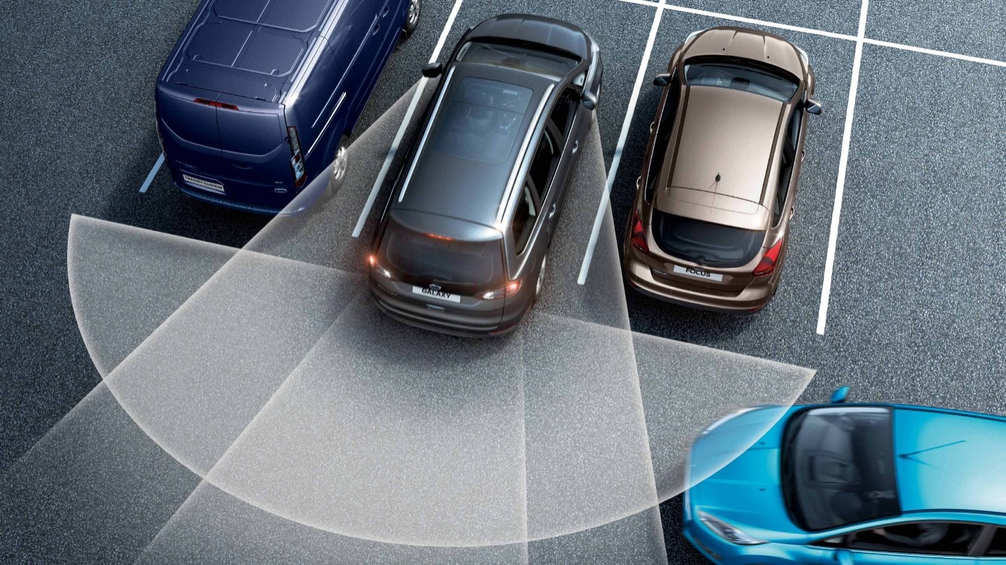Grey Ford Galaxy reversing from the parking spot, showing the Cross Traffic Alert Grey Ford Galaxy reversing from the parking spot, showing the Cross Traffic Alert