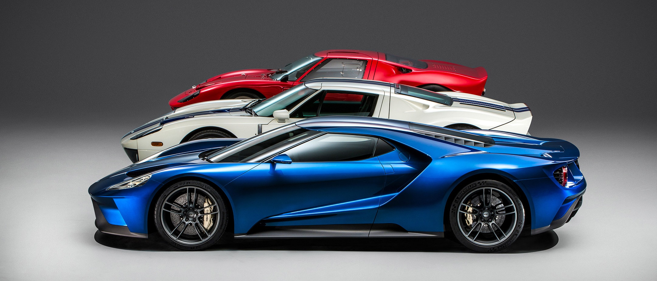 Ford GT generations blue 2016 model, white and red models