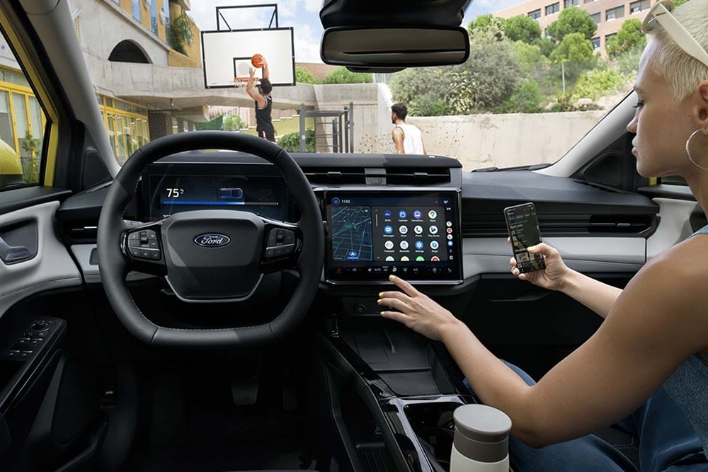 Interior of the Ford Puma Gen-E small car, showing touchscreen controls.