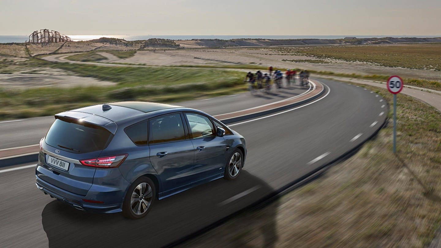Ford S-MAX driving on road by the beach