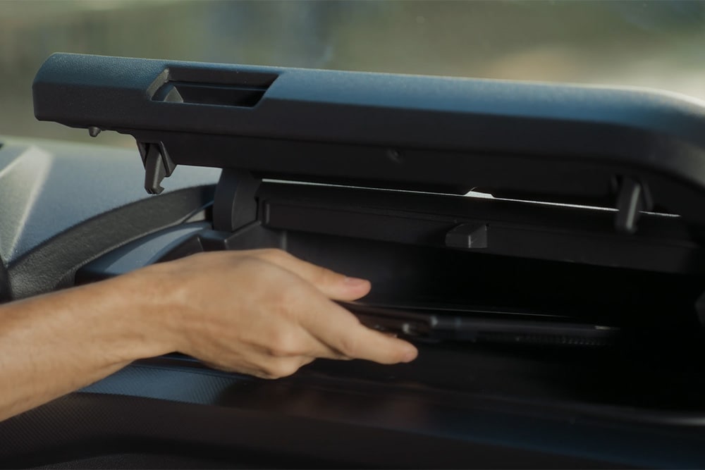 Person putting things in the storage compartment in the Tourneo Custom