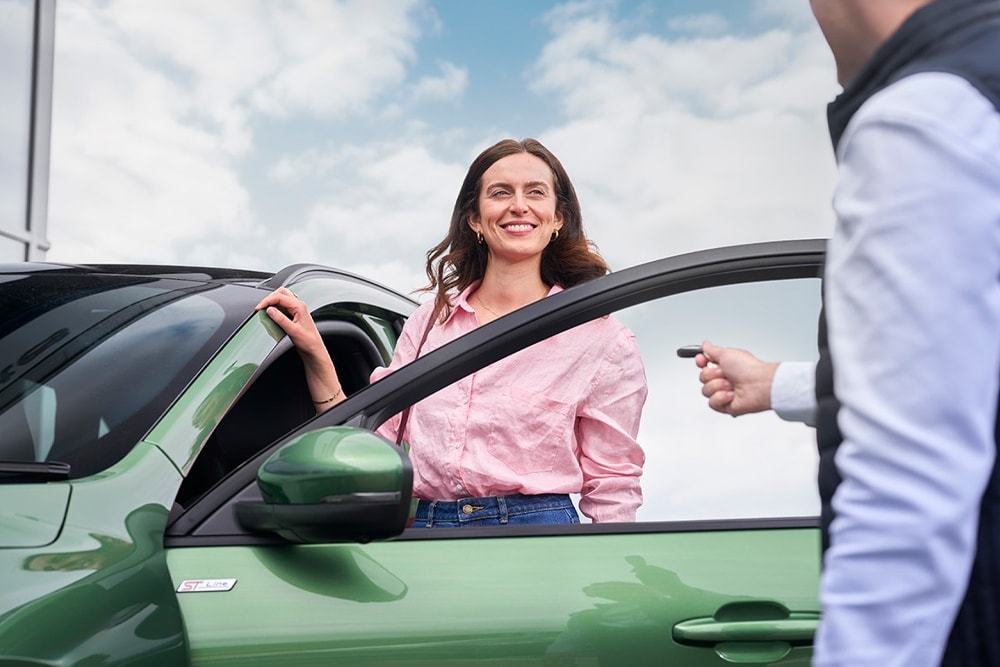 Employer hand over key to customer