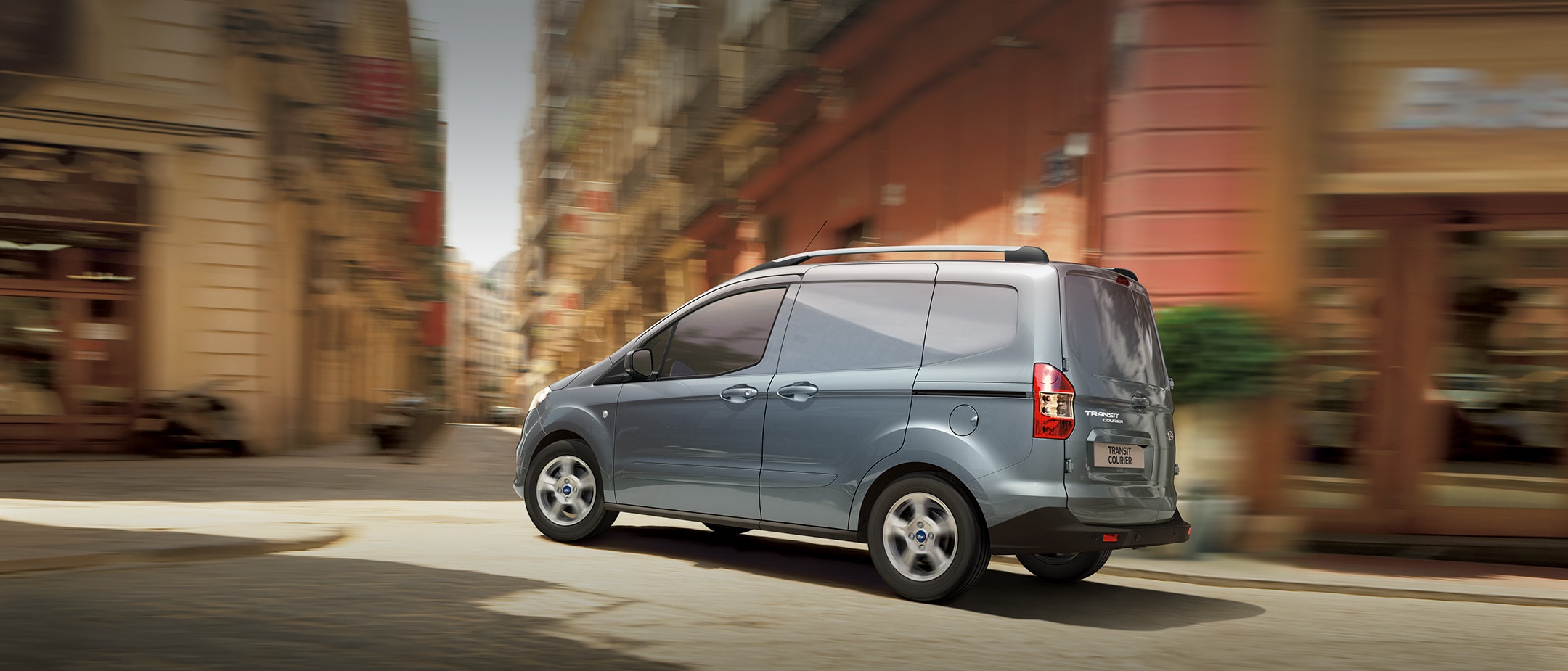 New Silver Ford Transit Courier in city lanes