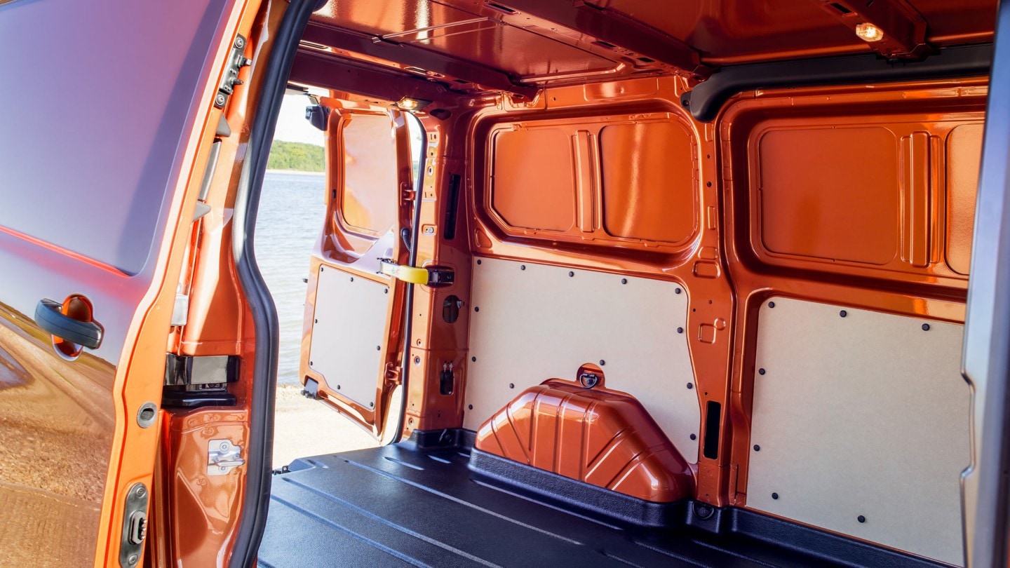 Orange Ford Transit Custom open loadspace with side and rear doors