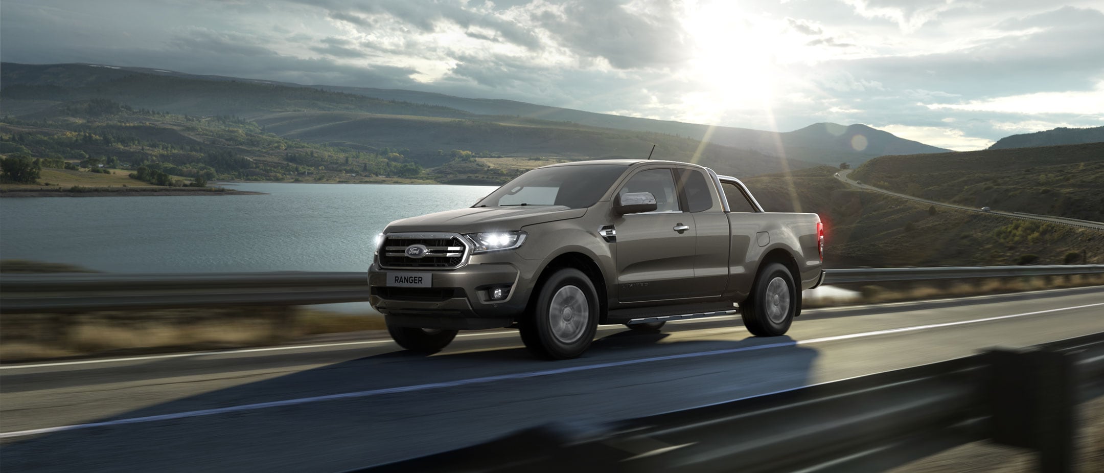 Ford Ranger Super Cab driving close to lake Ford Ranger Super Cab driving close to lake