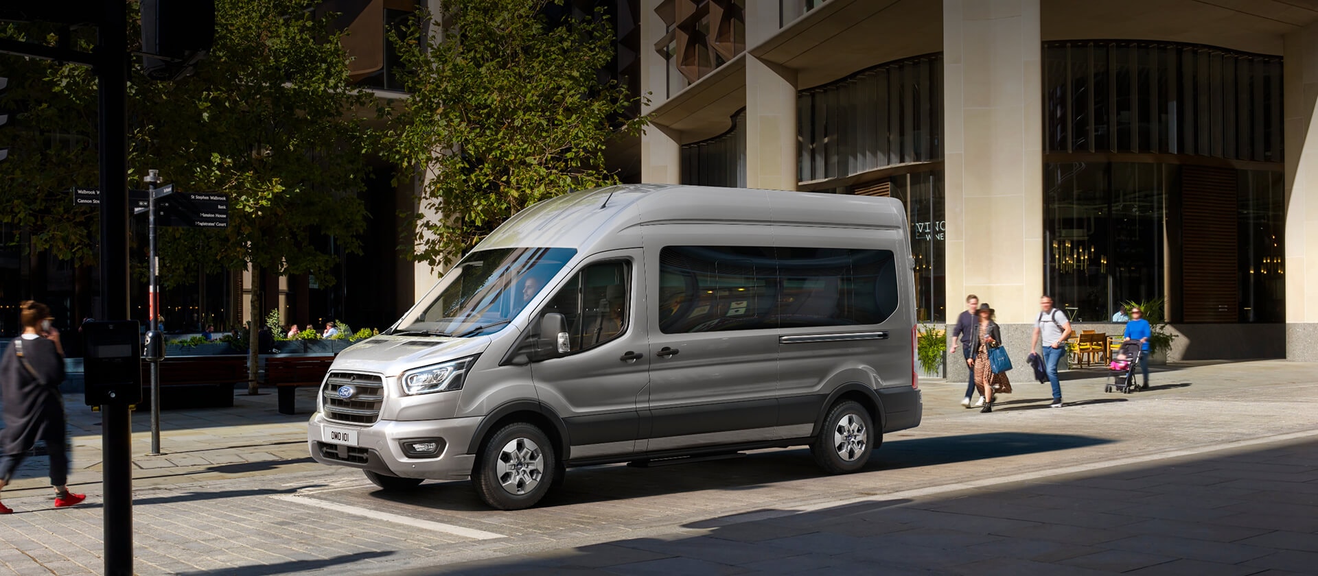 Ford Transit Minibus parked in front of modern building