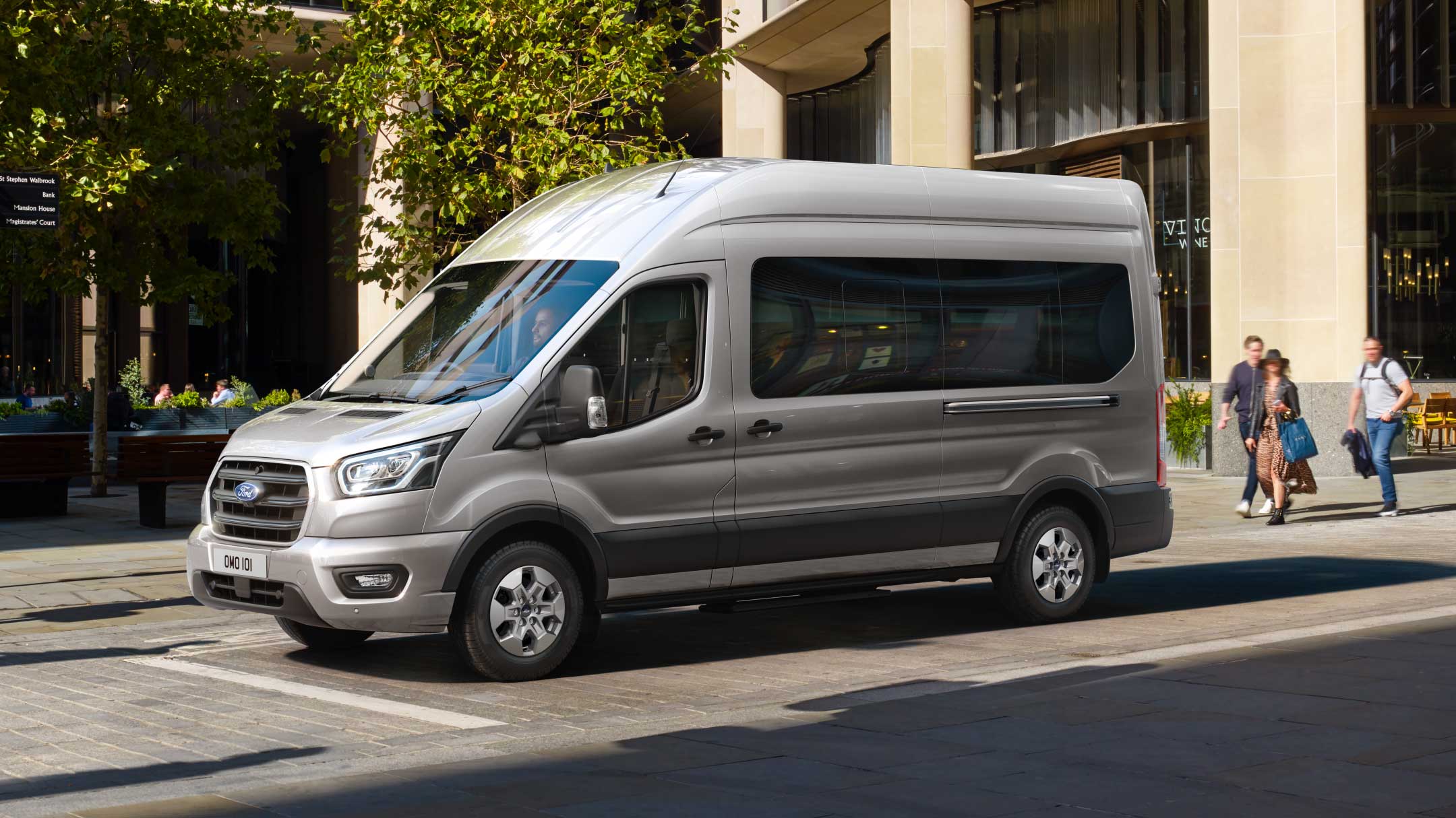 Ford Transit Minibus standing on a busy street