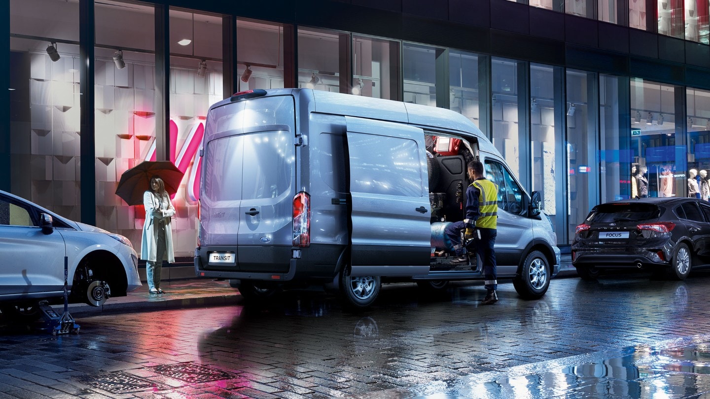 Ford Transit Van loaded from side doors at night