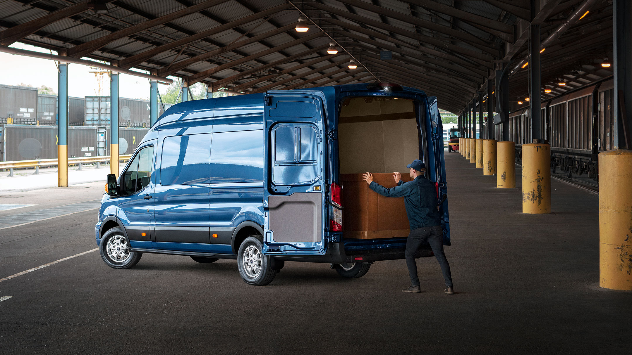 Blue Ford Transit Van side view with rear doors open