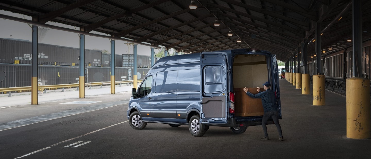 Man loading Transit Van rear view