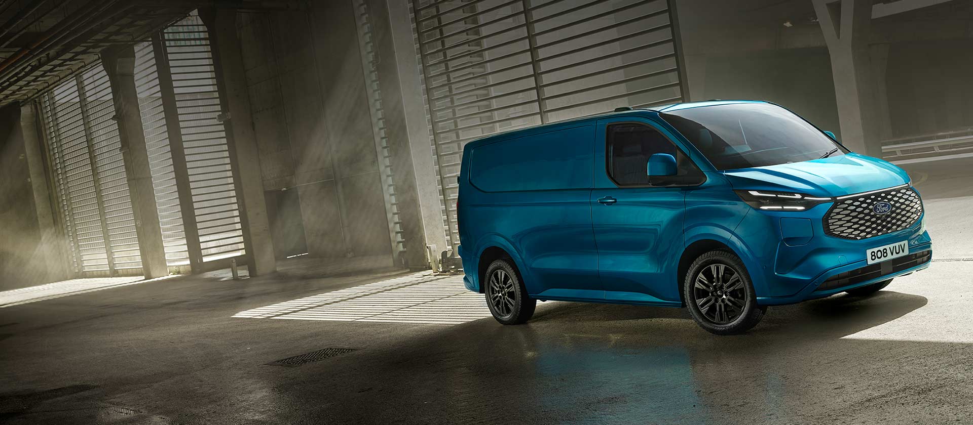 Blue Ford E-Transit Custom electric van.