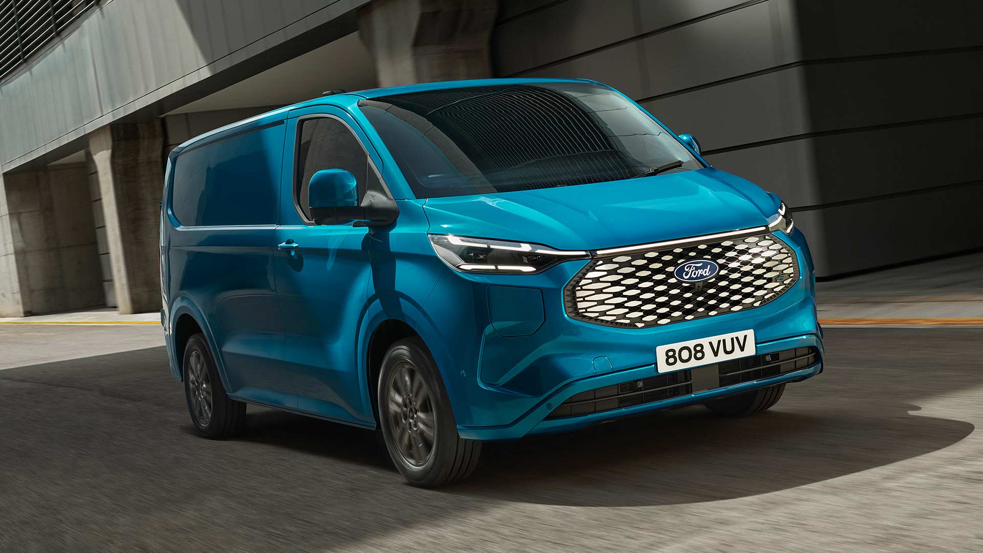 Blue Ford E-Transit Custom electric van driving.