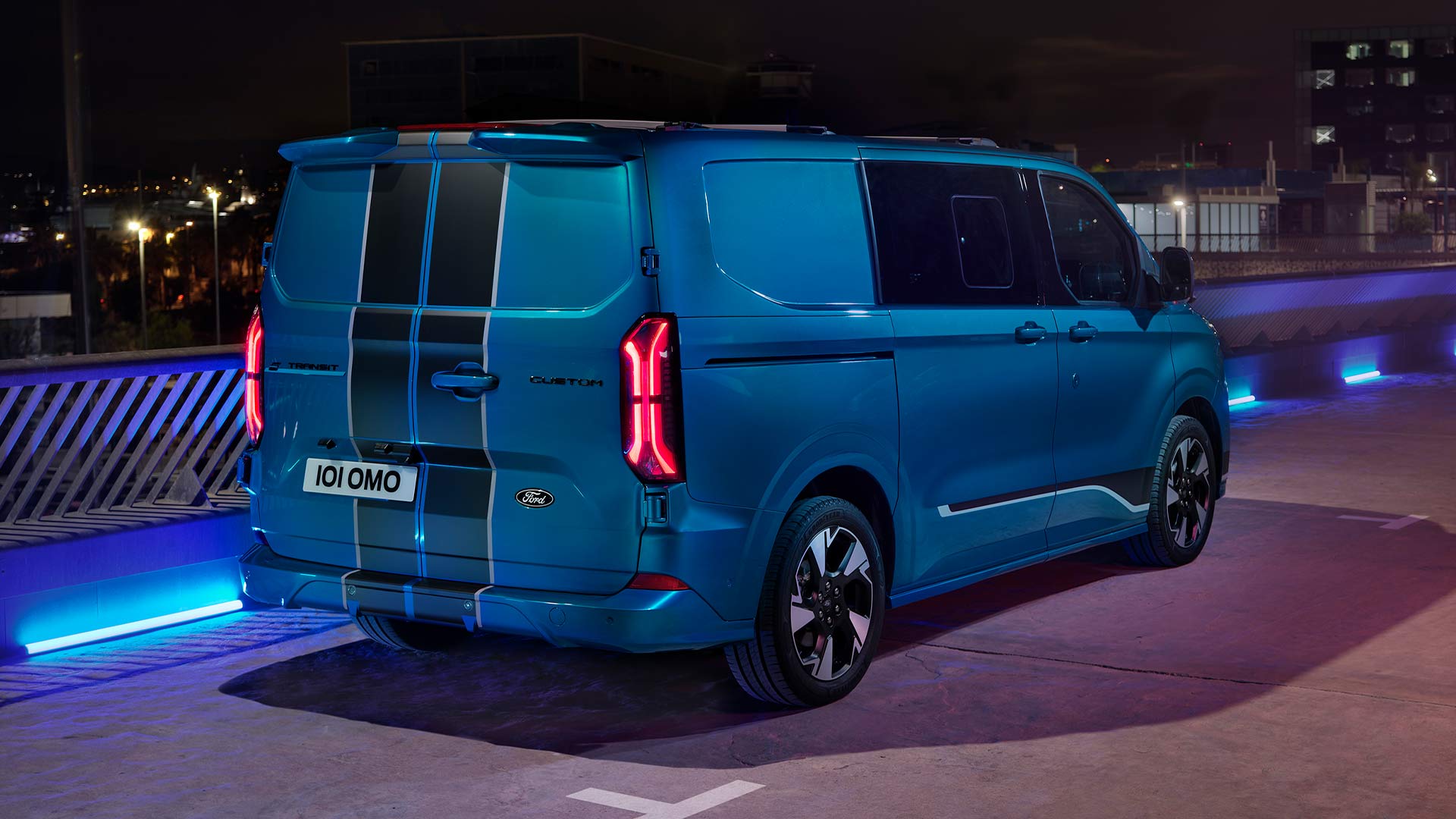Rear view of blue electric Ford E-Transit Custom Sport Double Cab-in Van.