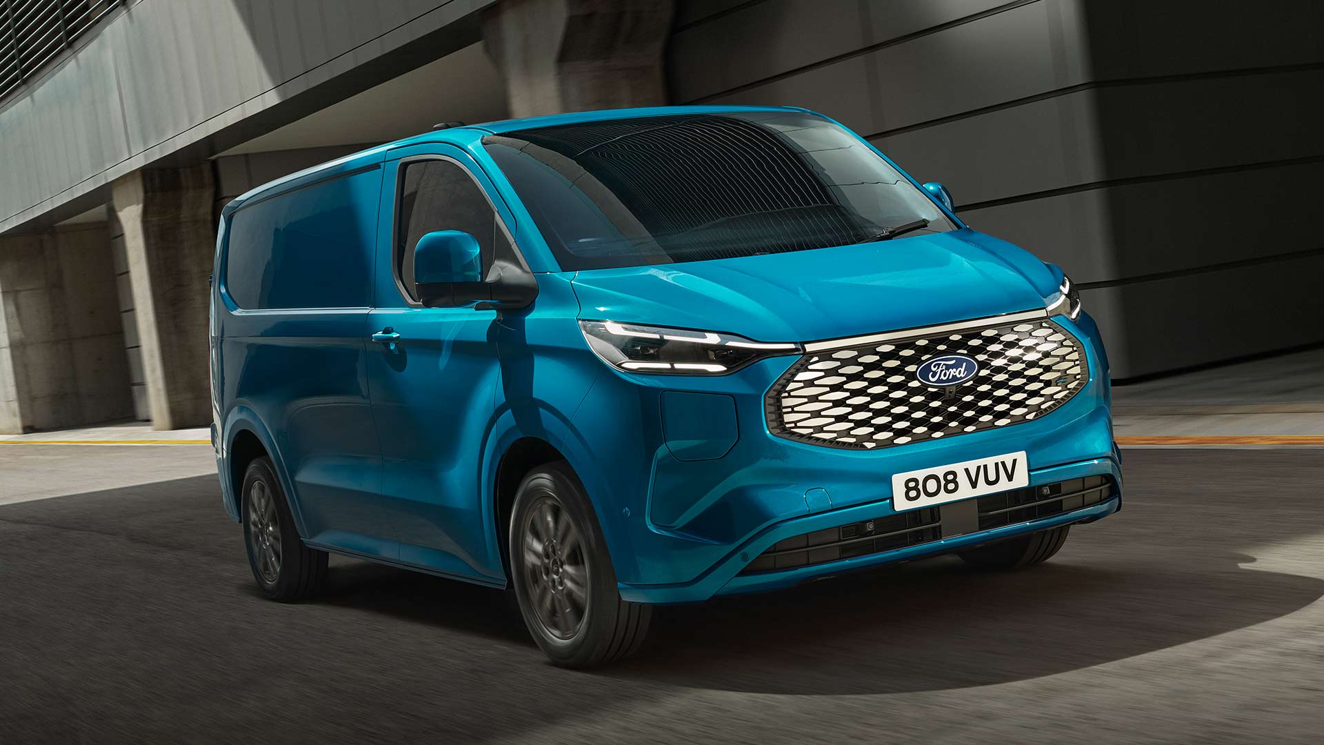 Blue Ford E-Transit Custom electric van driving.