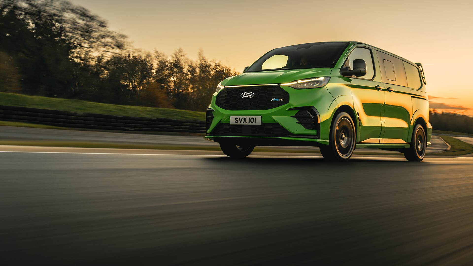 Green Ford Transit Custom MS-RT drives on a track.