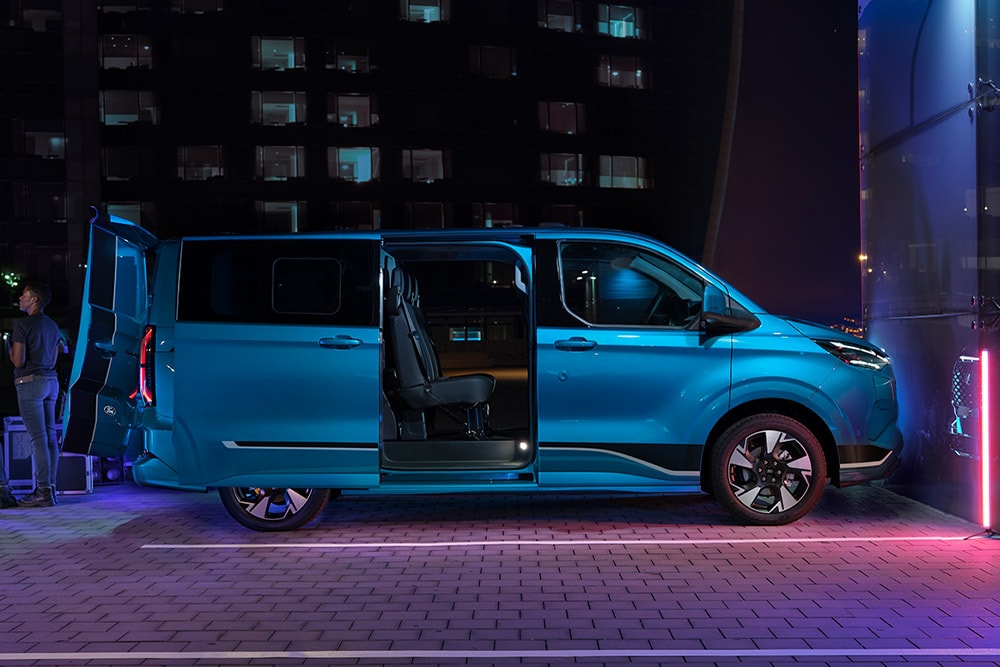 Blue Ford E-Transit Custom Double Cab-in-Van electric van with open doors.