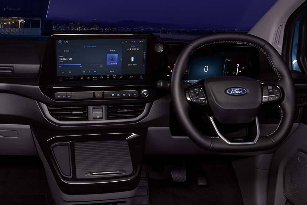 Interior of Ford E-Transit Custom electric van with driver and passenger seats.