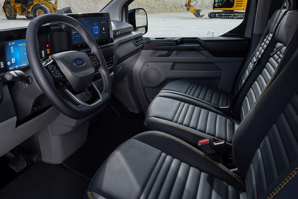 Interior of a Ford Transit Custom Sport van with black and gold seats.
